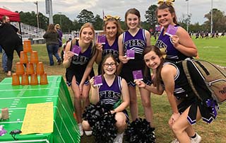 Fouke High School Panther Cheerleaders show their BEFAST magnets at the Stroke Zone setup by LifeNet EMS in Arkansas.
