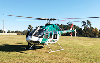 LifeNet Air medical helicopter lands at Spring Lake Park in Texarkana for the 5th Annual Turkey Trot fundraiser for Community Healthcore.