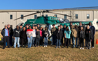 Coach Brown's 8th Grade Career Development Class at Malvern Middle School stands in front of the LifeNet Air medical helicopter in Malvern, Arkansas.